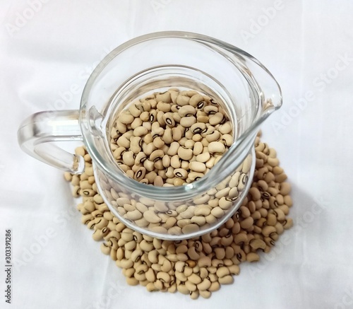 White beans in a jug isolated on the white background