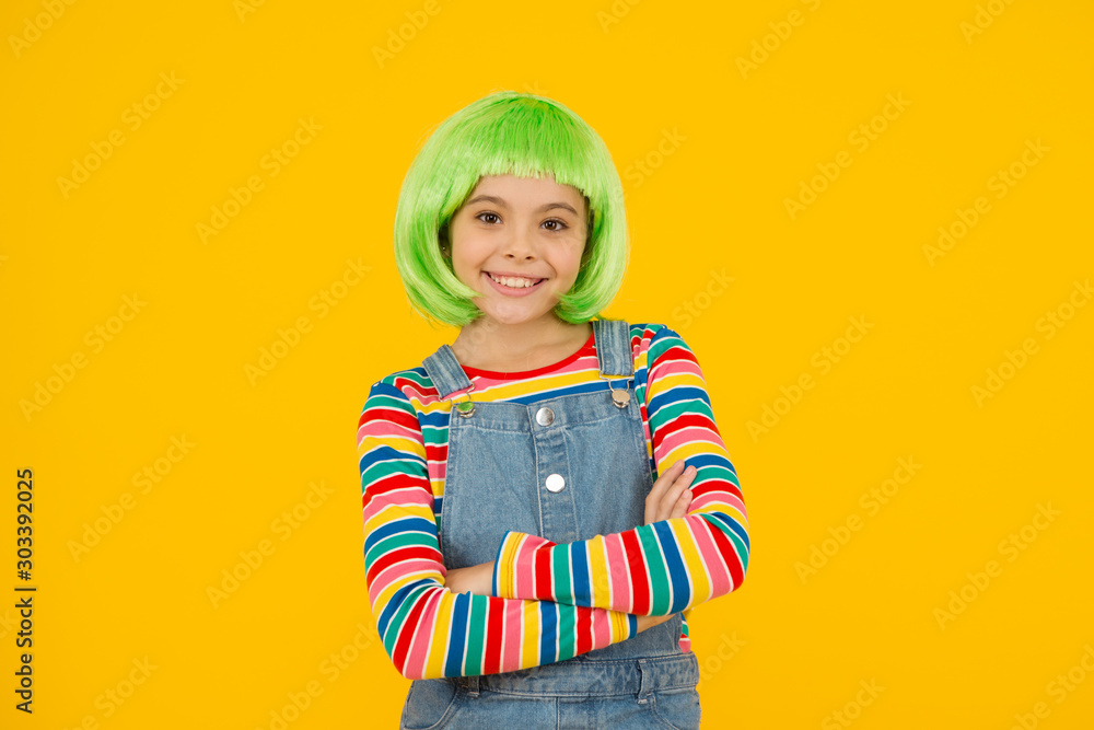 Fancy beauty. Beauty look of small fashion model. Happy girl wear green hair wig yellow background. Fashion and beauty. Beauty salon Fancy beauty. Beauty look of small fashion model. Happy girl wear green hair wig yellow background. Fashion and beauty. Beauty salon