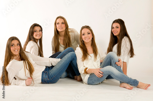seated young women looking at camera photo