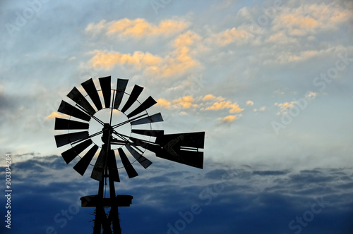 Rural Windmill and Clouds at Dusk