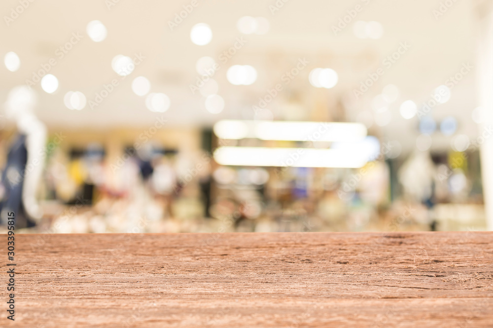 Wood table top on blur shopping mall. For montage and display products Wood table top on blur shopping mall. For montage and display products