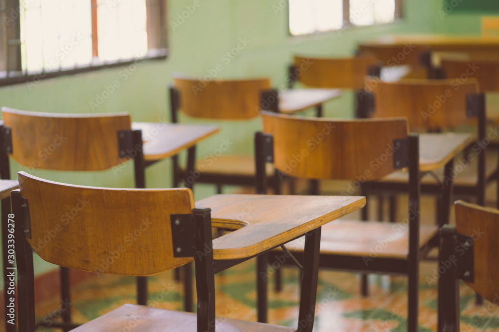Lecture room or Examination room.School empty classroom with desks and chair for studying lessons and examination in school at Thailand.Interior of secondary education with whiteboard.vintage tone. Lecture room or Examination room.School empty classroom with desks and chair for studying lessons and examination in school at Thailand.Interior of secondary education with whiteboard.vintage tone.