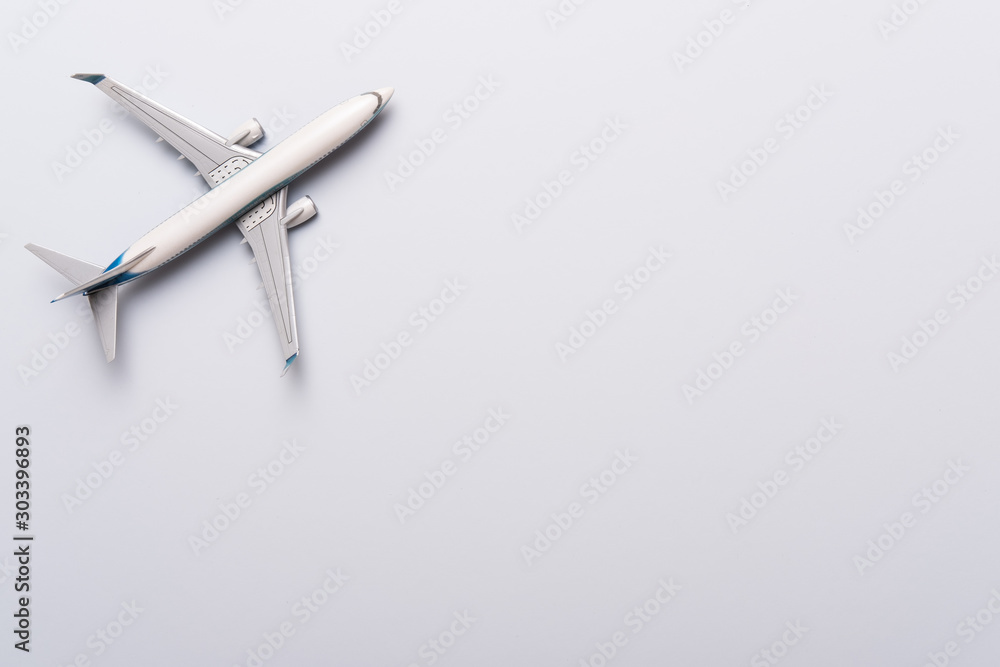 Model of plane, airplane on blue background. Flat lay design. Travel, vacation concept Model of plane, airplane on blue background. Flat lay design. Travel, vacation concept