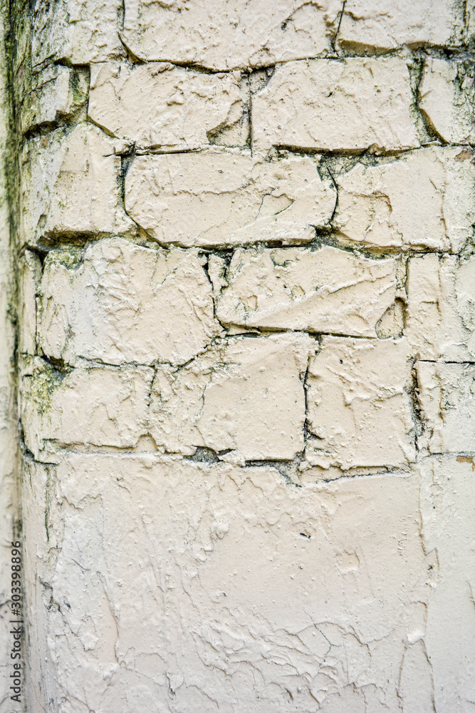 Texture of light yellow paint stucco on brick wall. Imitation of old castle wall Texture of light yellow paint stucco on brick wall. Imitation of old castle wall