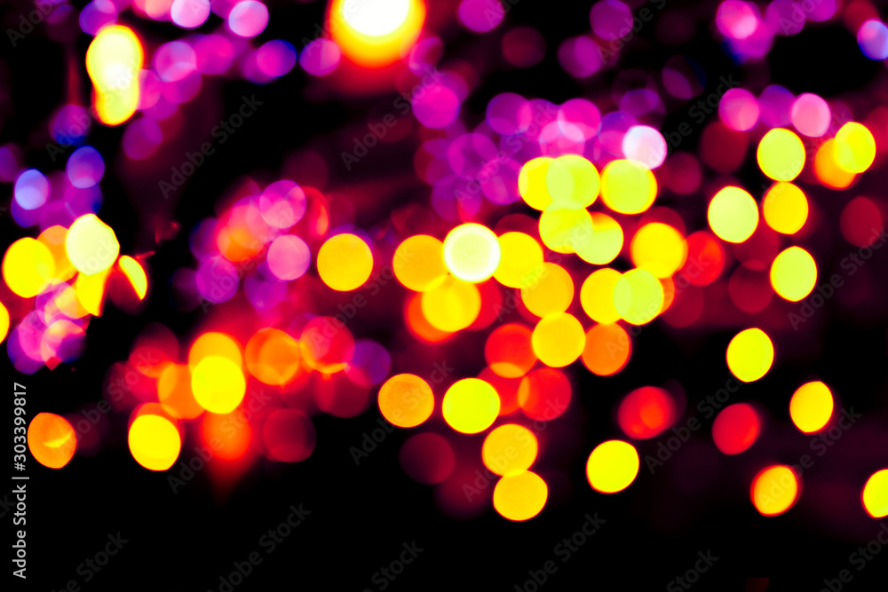 Colorful circles bokeh festive glitter dark background. Holiday greeting cards, invitations, flyers, blog posts, banners design. Christmas lights bokeh overlay.