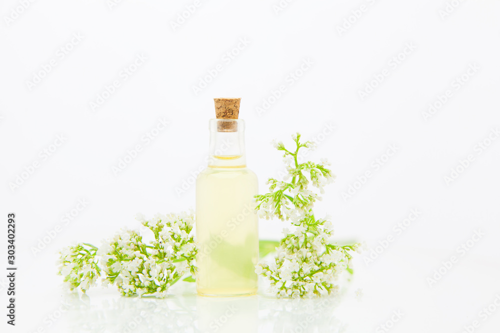 Essence of flowers on table in beautiful glass jar Essence of flowers on table in beautiful glass jar