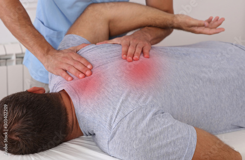 Chiropractic treatment. Shiatsu massage, Back Pain trigger points. Physiotherapy for male patient, Sport Injury Recovery