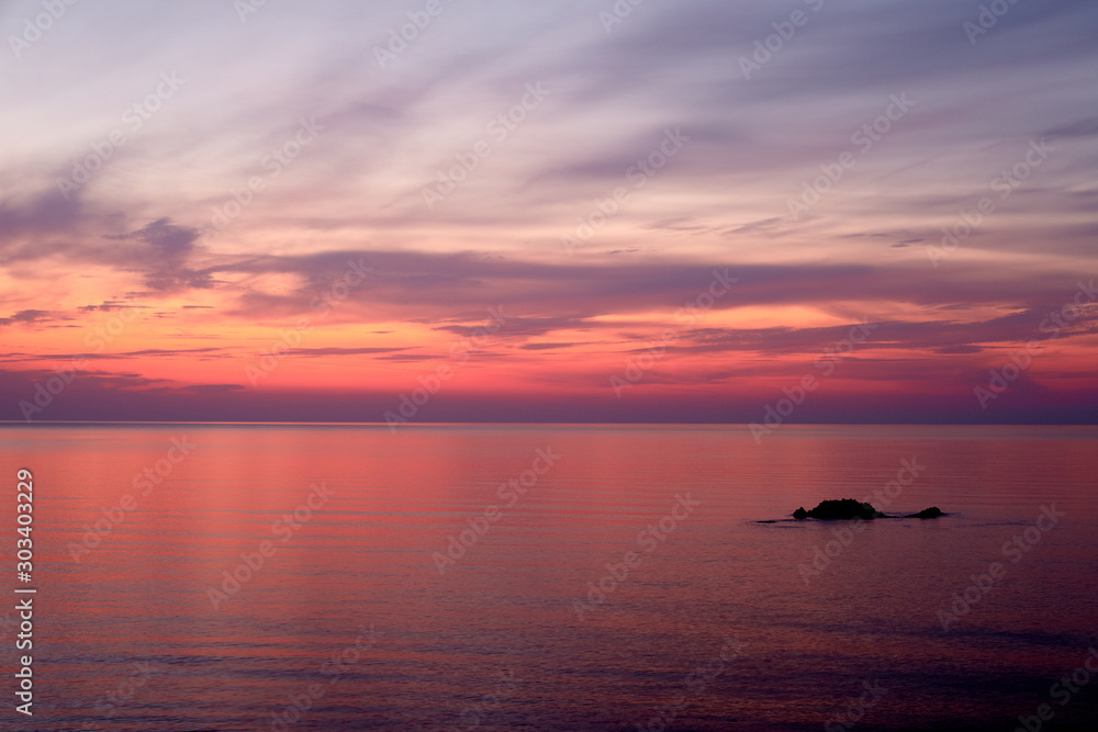 Sunrise in lilac colors on the sea