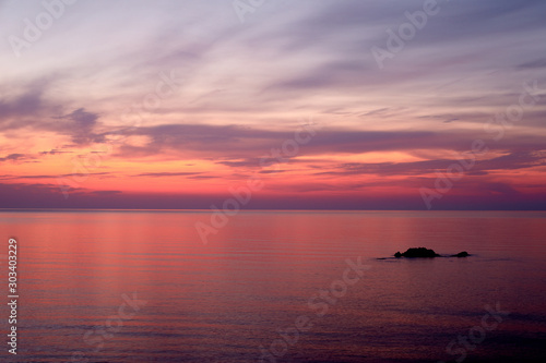 Sunrise in lilac colors on the sea