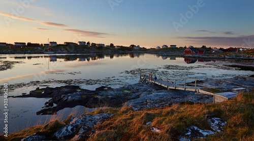 Sunny sunset in fjords, a bridge in a fishing village