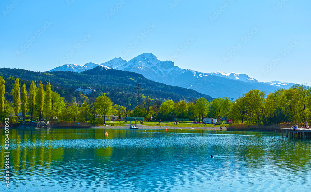 Beautiful Mountains and a lake in autumn.  Baggersee (Badesee Rossau), Innsbruck, Austria