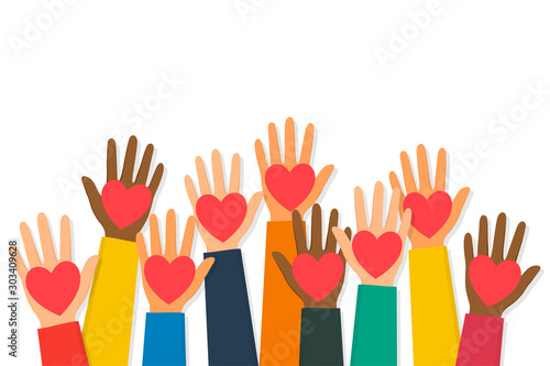 Charity, volunteering and donating concept. Raised up human hands with red hearts. Children's hands are holding heart symbols
