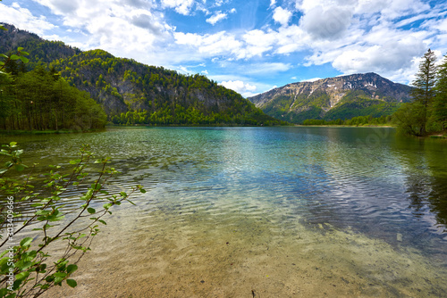 Beautiful Offensee lake landscape with mountains  forest  clouds and reflections in the water in Austrian Alps. Salzkammergut region.