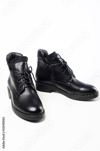 black new leather shoes on white background