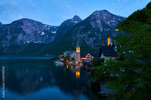 Beautiful night landscape of Hallstatt mountain village with Hallstatter lake in Austrian Alps. © Trambitski