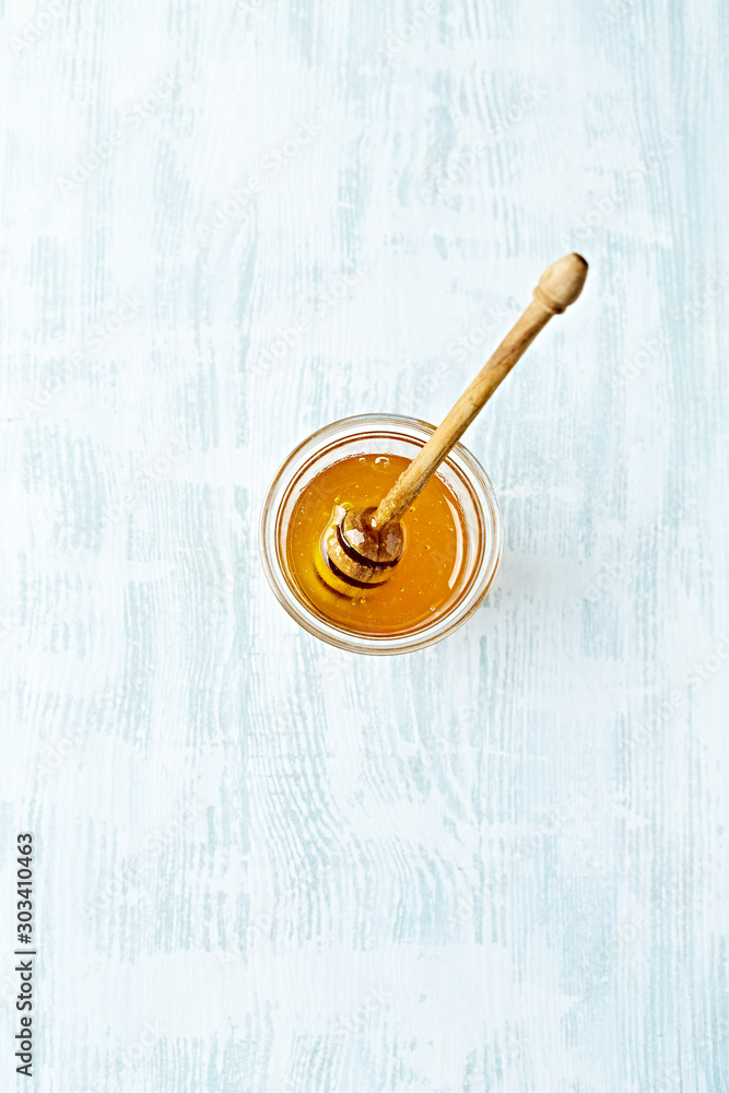 Organic lime flower honey in a glass. Natural food ingredients Organic lime flower honey in a glass. Natural food ingredients