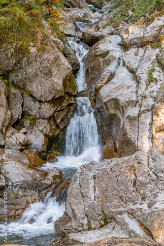 Waterfall in the park. Rosa Khutor. Autumn view.