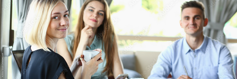 Business meeting in a cafe young beautiful men Business meeting in a cafe young beautiful men