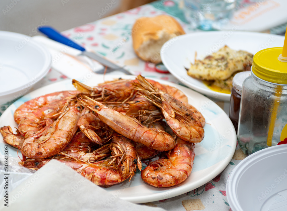 prawns baked in the foreground, fish after cooking prawns baked in the foreground, fish after cooking