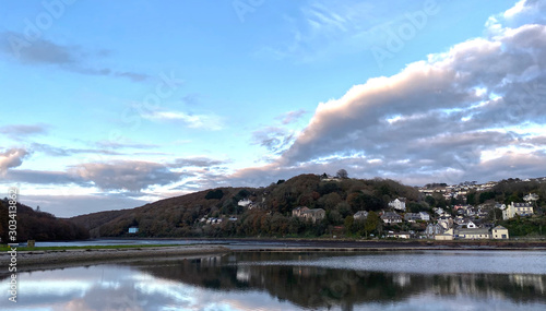 Still water reflecting and mirroring the autumnal landscape 