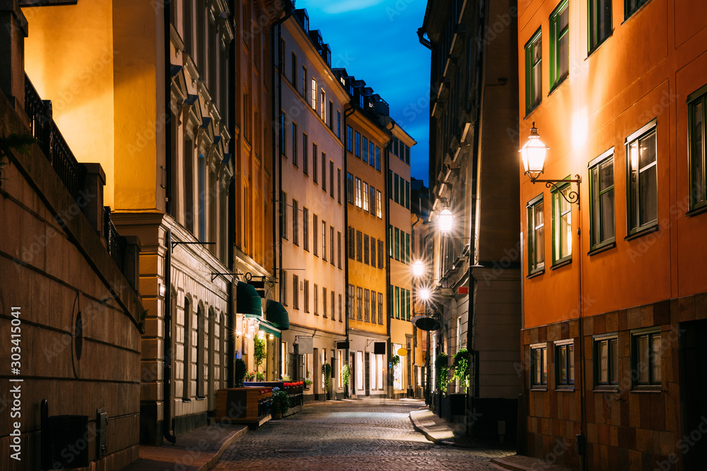 Stockholm, Sweden. Night View Of Traditional Stockholm Street. Residential Area, Cozy Street In Downtown. Osterlanggatan Street In Historical District Gamla Stan Stockholm, Sweden. Night View Of Traditional Stockholm Street. Residential Area, Cozy Street In Downtown. Osterlanggatan Street In Historical District Gamla Stan