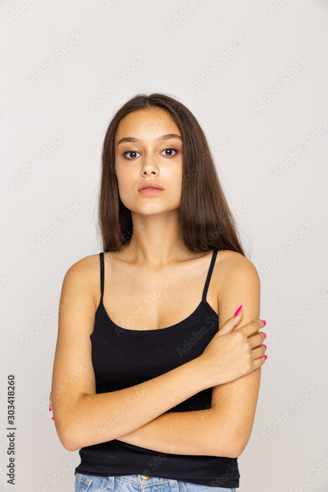 Female model with pretty face standing isolated on the white background Female model with pretty face standing isolated on the white background