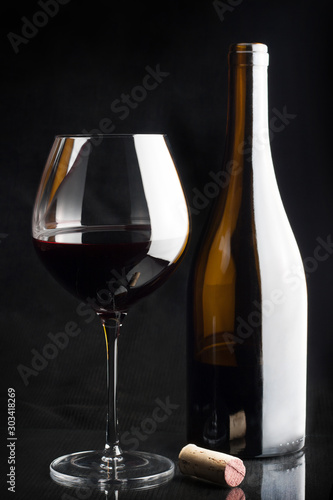 Burgundy wine glass bottle cork dark still life