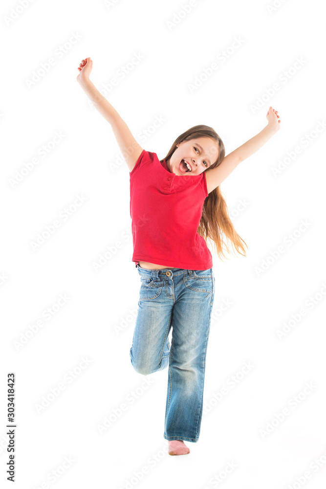 Happy child posing standing on one leg