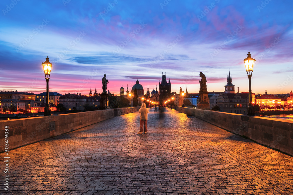 Charles Bridge along is beautiful view of Old Town buildings  in sunrise in Prague