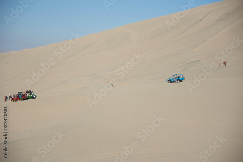 Tubular vehicle riding the dunes in Huacachina  ica desert  Peru