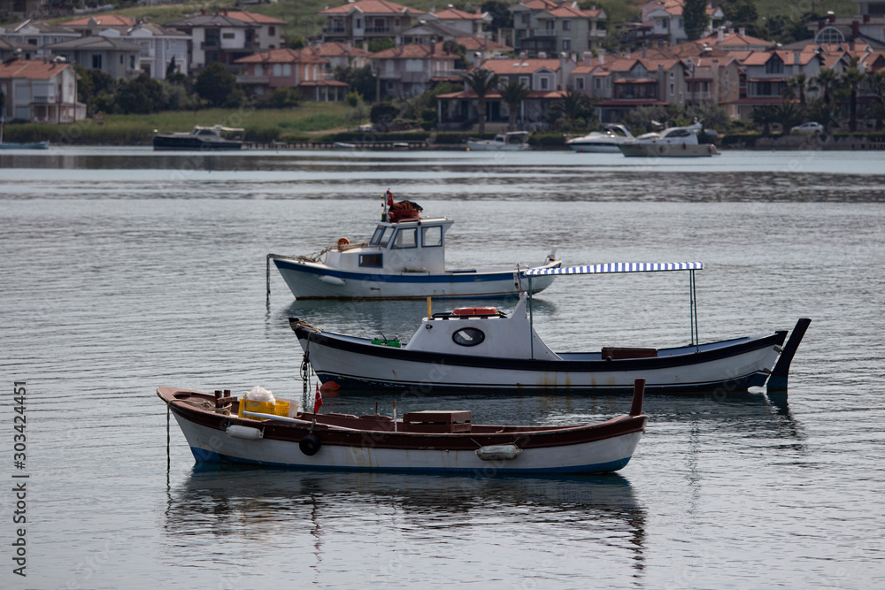 Moored boats with reflections. fishing boat at the Cunda Balıkesir TURKEY.