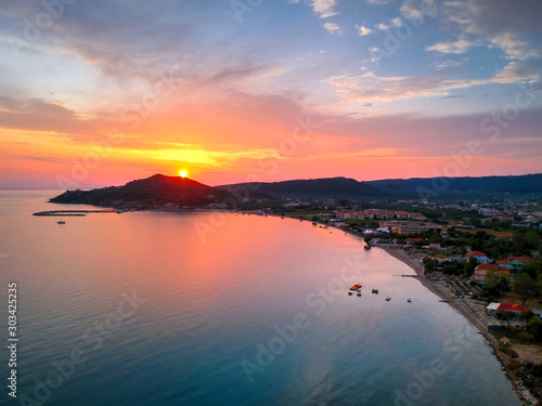 Sunrise in Alykes tourist resort, Zakynthos, Greece. Sunrise in Alykes from above.