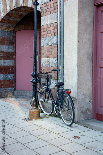 bicycle in front of an old house