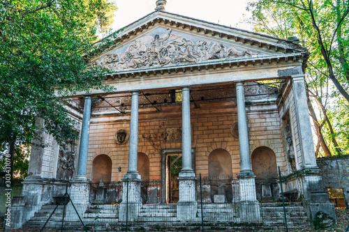 Photography Abandoned ancient building in Villa Torlonia public park in Rome, Italy