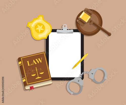 Arrest warrant on black tablet lies with police handcuffs and legal book, gavel and golden badge on wooden table