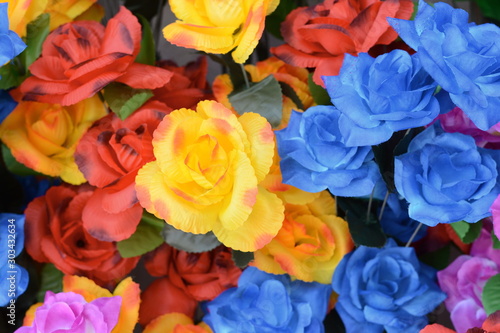 Beautiful multicolored artificial flowers background