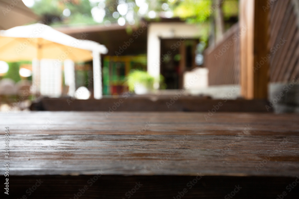 Wooden desk on bokeh blur abstract natural background