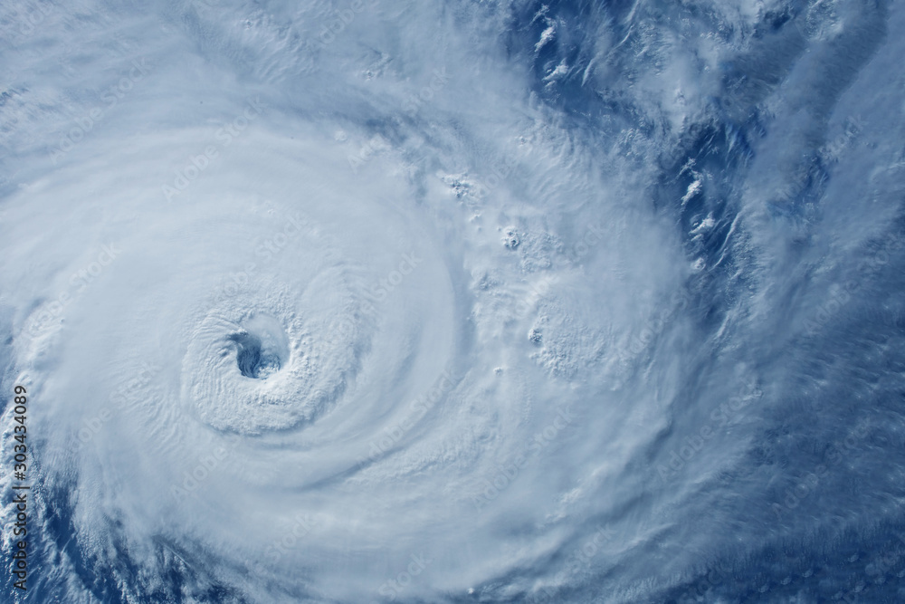 Naklejka Typhoon from space near the coast. Elements of this image were furnished by NASA.