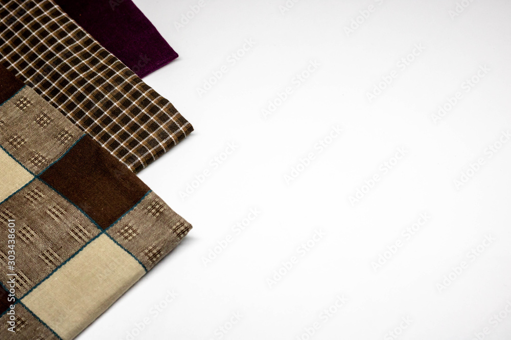 Brown checked tablecloth isolated on white with room for text. Brown checked tablecloth isolated on white with room for text.