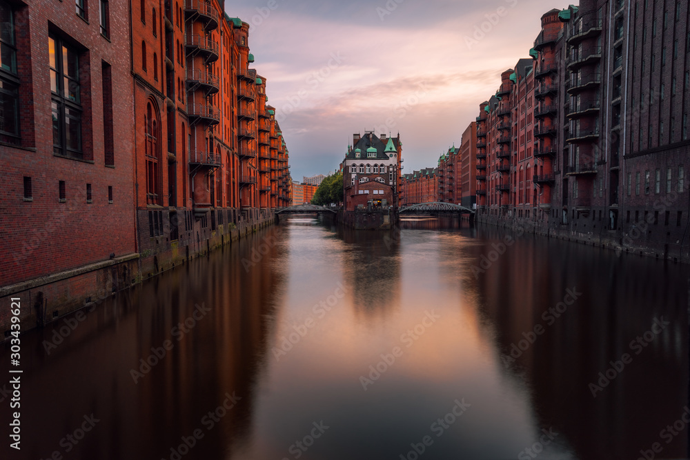 Hamburg, Warehouse District Speicherstadt. Germany, Europe. View of Wandrahmsfleet on evening light, famous sightsee located in the port of Hamburg
