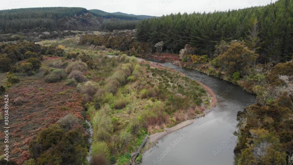 Aerial view of the Tauranga Taupo river, a popular trout fishing river in New Zealand, scenic remote valley, tranquil wilderness in the North Island of NZ Aerial view of the Tauranga Taupo river, a popular trout fishing river in New Zealand, scenic remote valley, tranquil wilderness in the North Island of NZ
