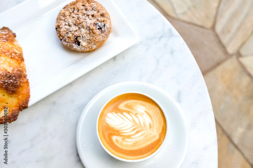 White cup of coffee latte and tart. White cup of coffee latte and tart.