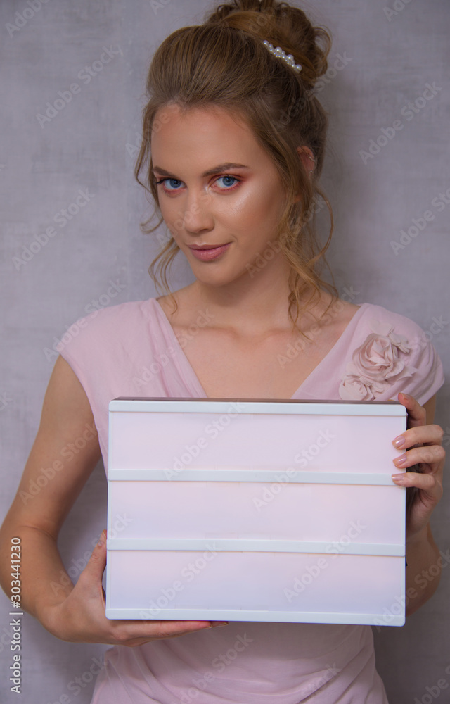 Bridal look, wedding style, make up and hairstyle, saloon ready commercial type, blond model, young woman with blue eyes, , twisted hair fresh and tender trendy look Bridal look, wedding style, make up and hairstyle, saloon ready commercial type, blond model, young woman with blue eyes, , twisted hair fresh and tender trendy look