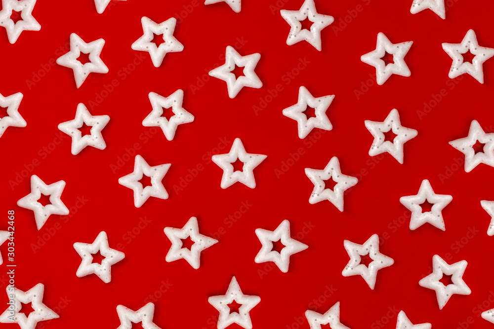 many white stars on a bright red background. Pattern of Christmas decorations. many white stars on a bright red background. Pattern of Christmas decorations.