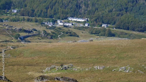 View from the mountain of steam train passing Rhyd Ddu village in Snowdonia, Wales, UK. photo