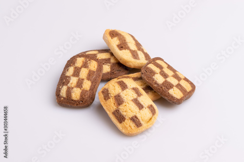 Home made cookies with chocolate, butter and vanilla, isolated on white background, soft light, angle view, copy space