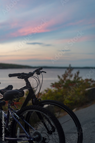 Bikes by a lake at sunset © Joyce Vincent