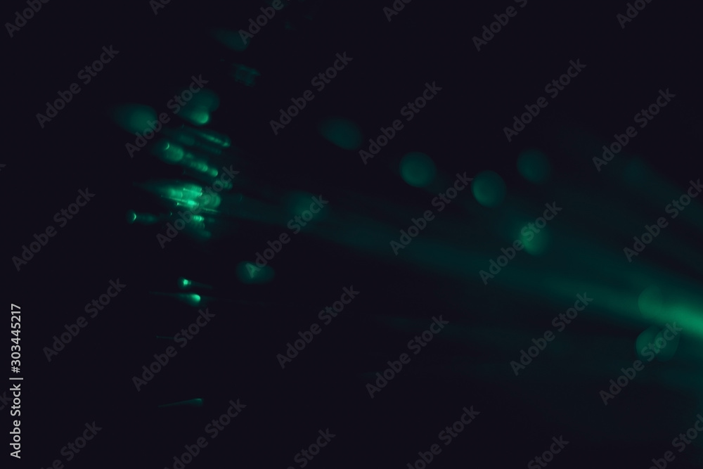 Obraz premium Lens Flare. Light bokeh, black background. Easy to add over photos. Abstract sun burst with digital lens flare background. Gleams rounded and hexagonal shapes. Bokeh light, shimmering blur spot lights