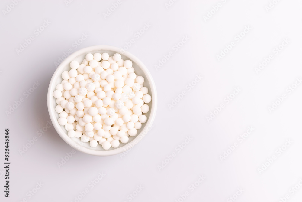 Tapioca pearls or sagu seeds, isolated on white background, soft light, studio photo Tapioca pearls or sagu seeds, isolated on white background, soft light, studio photo