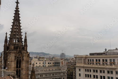 Scenic panoramic vista from the roof of the Barcelona Cathedral under the overcast sky